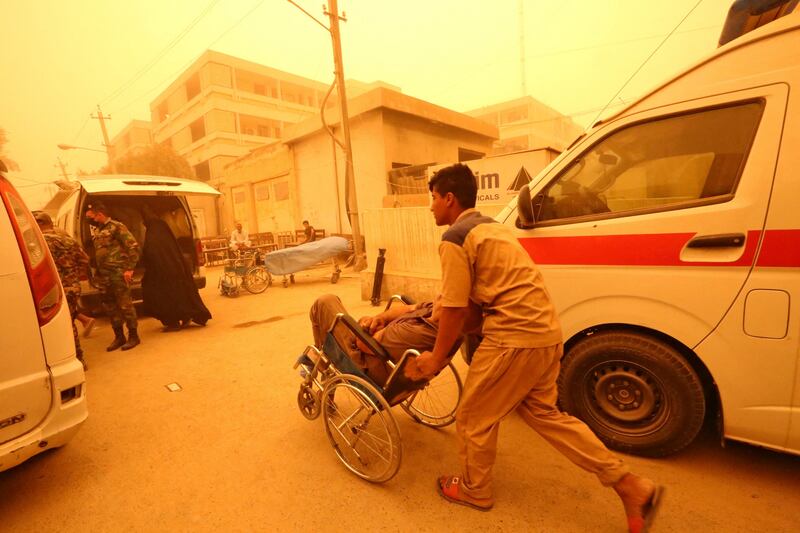 A patient suffering from breathing problems arrives for care at Sheikh Zayed Hospital in Baghdad. AFP