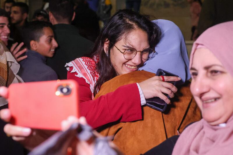 A Palestinian is greeted by her family in Baytunia after being freed from jail. AFP