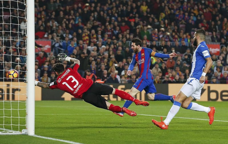 Barcelona’s Lionel Messi scores against Leganes. Albert Gea / Reuters