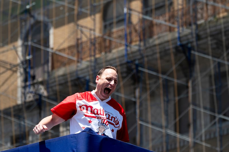 Mr Chestnut makes a grand entrance at the Nathan’s Famous Fourth of July hot dog eating contest in Coney Island. AP