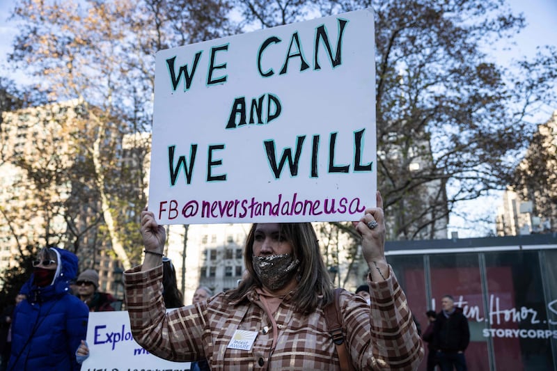 Demonstrators rally in solidarity with the Epstein and Maxwell survivors in New York City. AFP