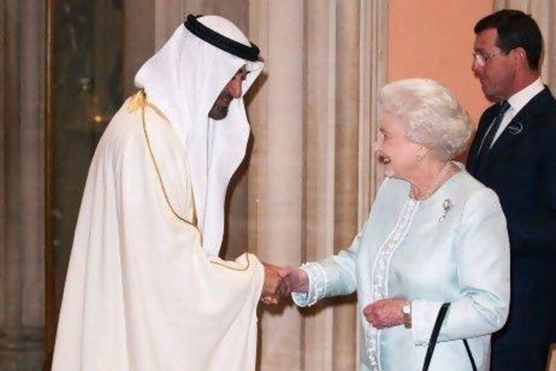 Britain's Queen Elizabeth II (R) greets Crown Prince of Abu Dhabi Mohammed bin Zayed al Nayan, upon his arrival at Windsor Castle, west of London, on May 18, 2012, for a Sovereign's Jubilee Lunch hosted by Britain's Queen Elizabeth II. A glittering lunch for the world's sovereigns to be held today to celebrate the diamond jubilee of Britain's Queen Elizabeth II has been marked by a withdrawal and protests over the guest list. AFP PHOTO / POOL / Dominic Lipinski

 *** Local Caption *** 546149-01-08.jpg