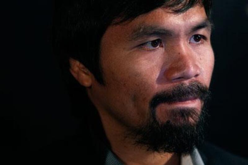 Manny Pacquiao's boxing record stands at 54 wins, five losses and two draws. Tyrone Siu / Reuters