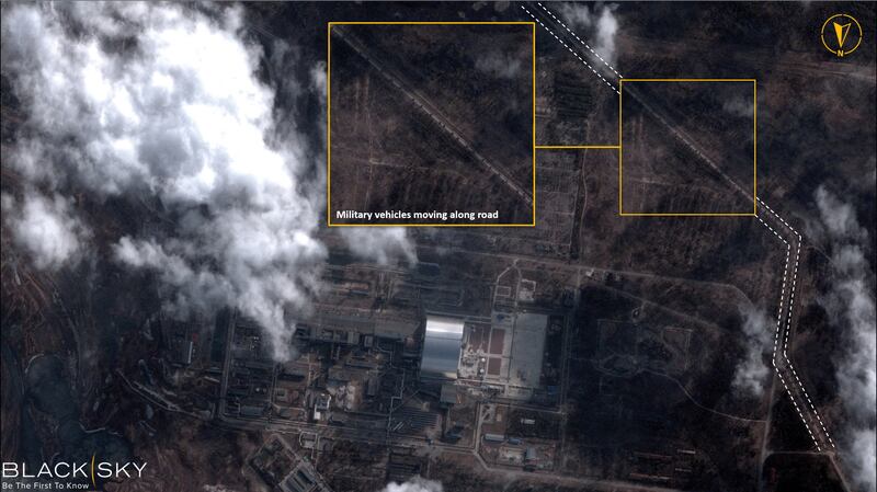 A satellite image with overlaid graphics shows military vehicles alongside the Chernobyl Nuclear Power Plant. Reuters