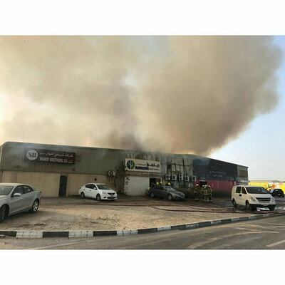 A fire breaks out at two warehouses in Al Quoz on Tuesday afternoon. Courtesy Dubai Civil Defence.
