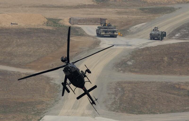 A Kiowa Warrior helicopter hovers during the United States and South Korean Joint live fire Exercise at Rodriguez Range in Pocheon, South Korea. Chung Sung-Jun / Getty Images