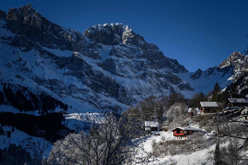 Snow-covered chalets at the bottoms of a mountain in the Swiss Alps in Engelberg. AFP