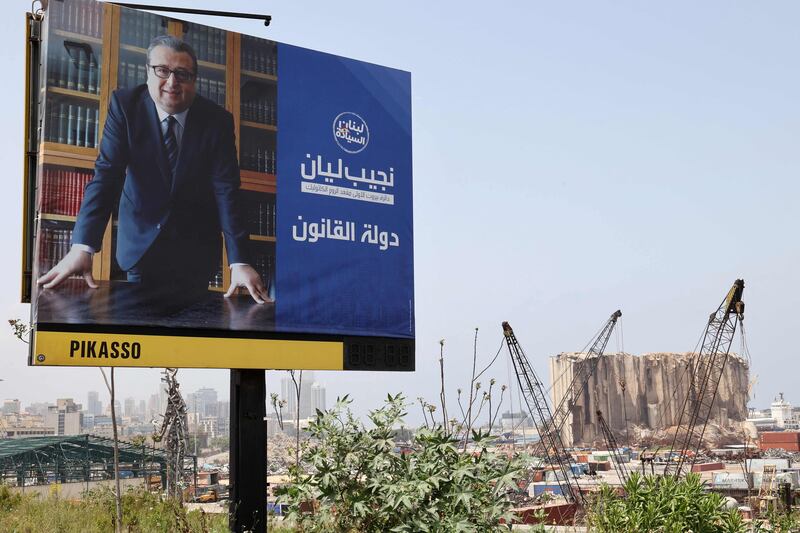 An electoral billboard for Najib Lyan, a candidate in the upcoming parliamentary election, next to the Beirut Port. AFP