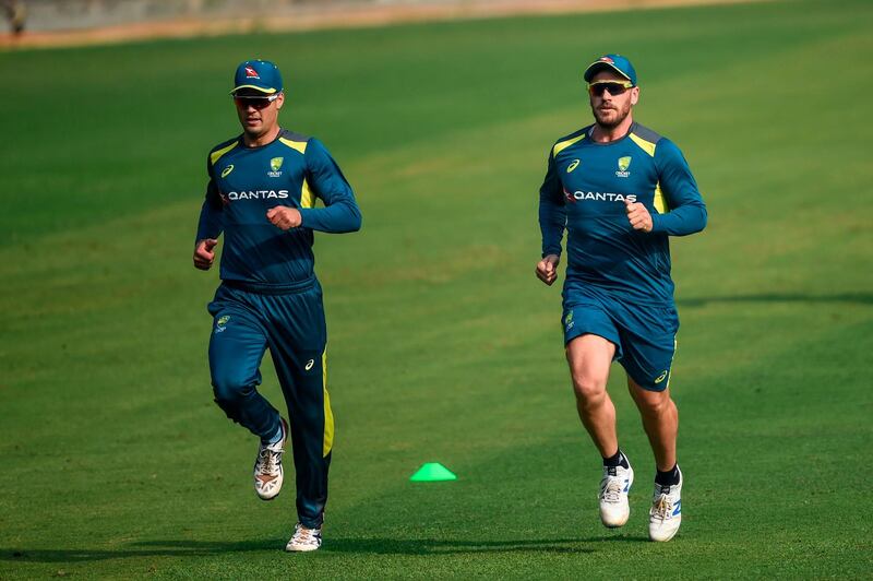 Australia's Alex Carey, left, and captain Aaron Finch during a training session at the Wankhede Stadium in Mumbai on Sunday. AFP