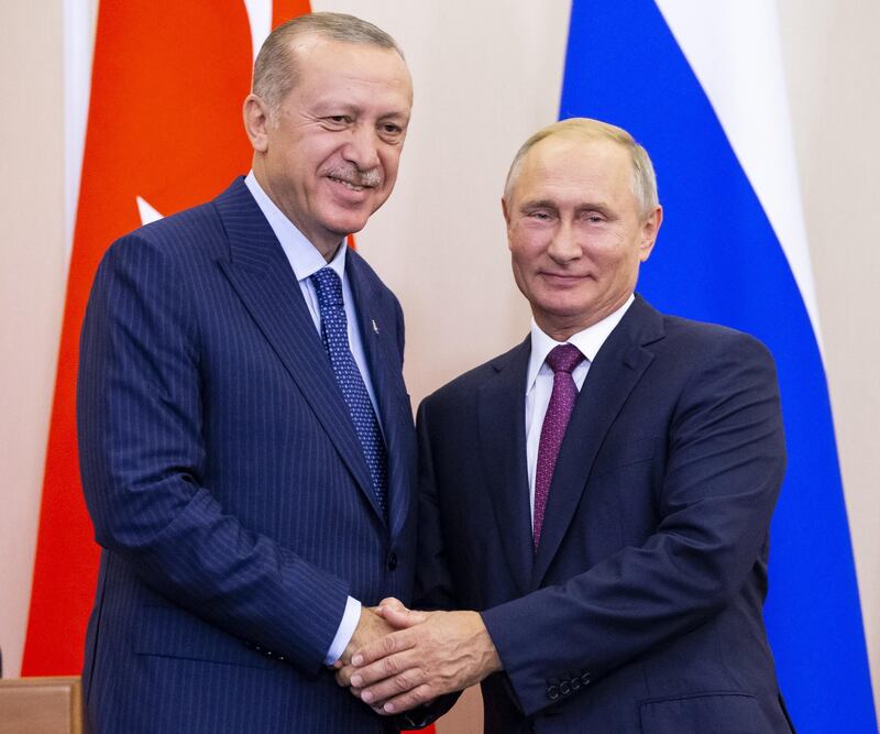 FILE PHOTO: Russian President Vladimir Putin (R) and his Turkish counterpart Tayyip Erdogan shake hands during a news conference following their talks in Sochi, Russia September 17, 2018. Alexander Zemlianichenko/Pool via REUTERS/File Photo