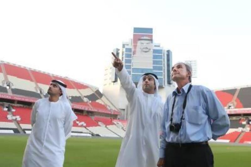 Inaki Alvares, Fifa's director of competitions, and other Fifa delegates, assess the pitch and facilities at Mohammed bin Zayed Stadium in Abu Dhabi yesterday. Delores Johnson / The National