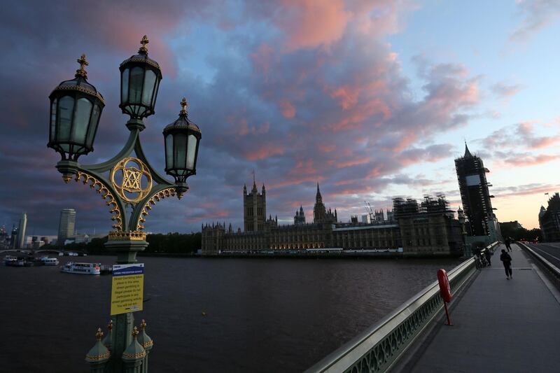 The sun sets behind the Palace of Westminster, home to the Houses of Parliament, as life in Britain continues during the lockdown because of the coronavirus pandemic. AFP