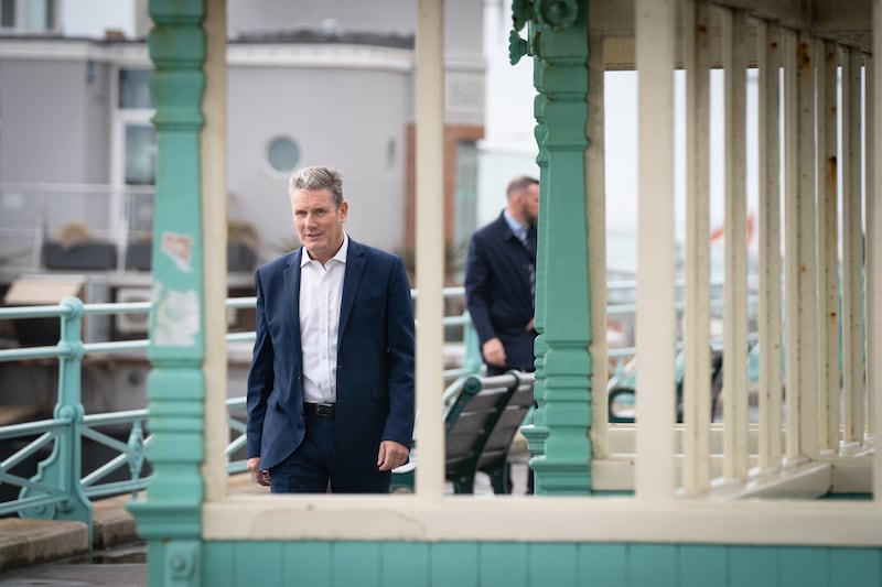 Keir Starmer walks along Brighton seafront promenade. This is Mr Starmer's first conference as Labour Party leader. PA