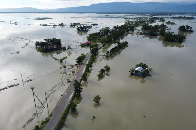In this aerial photo inundated houses are seen in Sunamgong on July 14, 2020. AFP