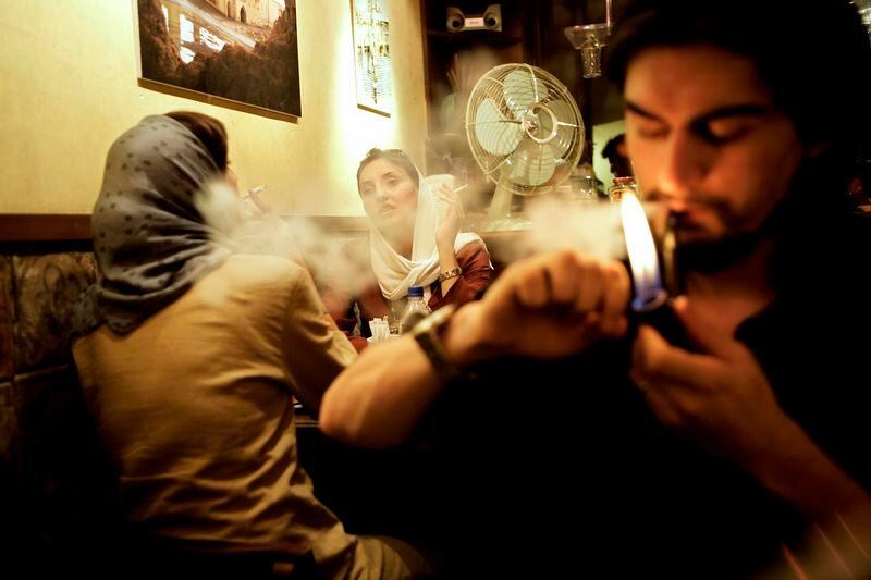Tehrani boys and girls in an uptown coffeeshop. (Photo by Newsha Tavakolian for The National) *** Local Caption ***  IRAN YOUTH AND RAP 04.jpg