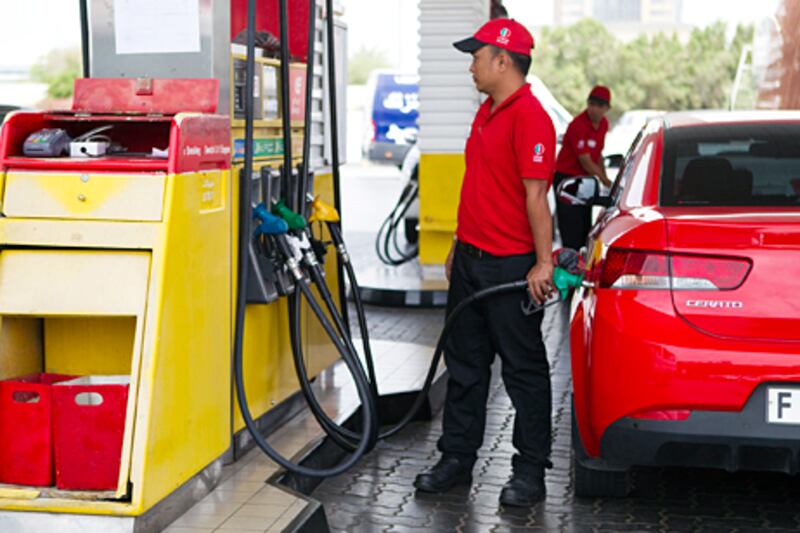 Dubai, April 03 2012 -- STOCK photograph of Eppco workers pumping petrol at a fuel station, April 03, 2012.  (Sarah Dea/ The National)