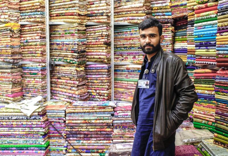 Abu Dhabi, United Arab Emirates, January 5, 2020.  
--  Shazaib Beeba, 26, Pakistan, has benn working for a garments stall for 3 years now at the Pakistan Pavillion.
Photo essay of Global Village.
Victor Besa / The National
Section:  WK
Reporter:  Katy Gillett