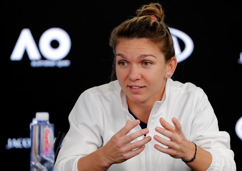Romania's Simona Halep gestures during a press conference at the Australian Open tennis championships in Melbourne, Australia, Saturday, Jan. 13, 2018. (AP Photo/Vincent Thian)
