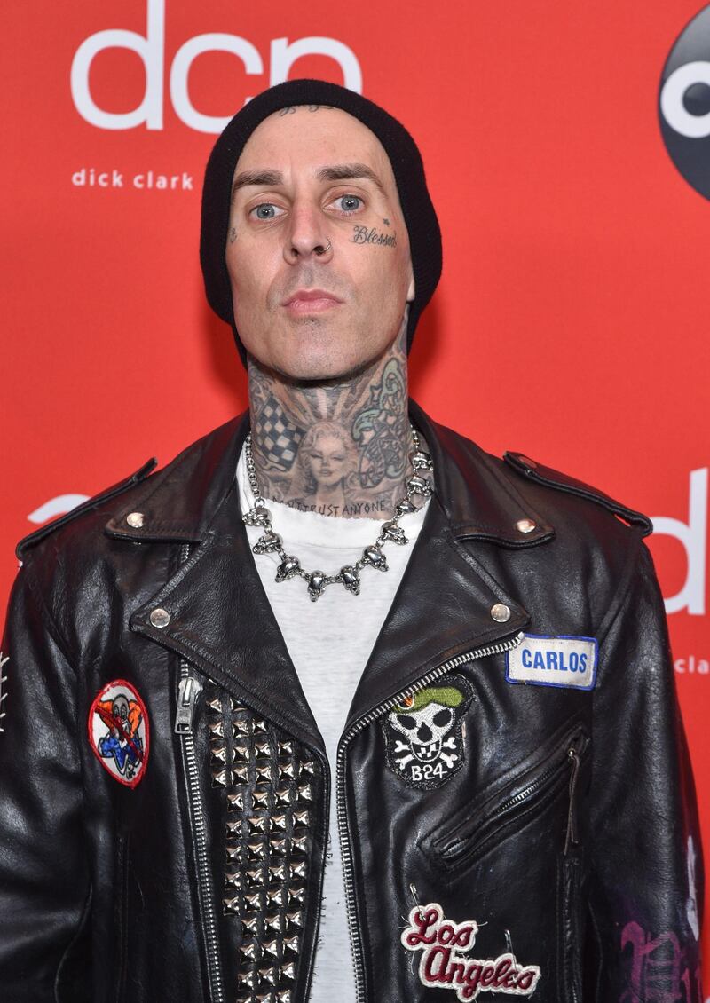 Travis Barker arrives at the American Music Awards at the Microsoft Theatre on November 22, 2020 in Los Angeles. AFP
