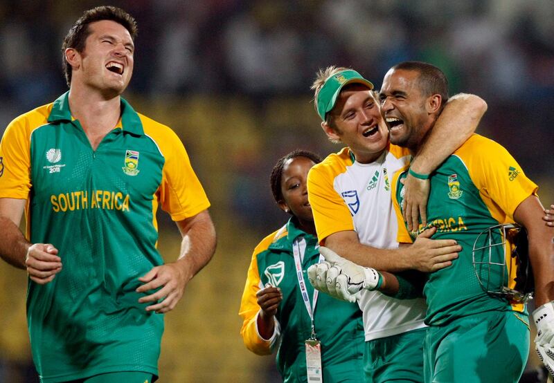 South Africa's Robin Peterson, right  celebrates with Colin Ingram, center and captain Graeme Smith as South Africa beat India during a Cricket World Cup match between India and South Africa in Nagpur, India, Saturday, March 12, 2011. (AP Photo/Gemunu Amarasinghe) *** Local Caption ***  WCCDA393_India_Cricket_WCup_India_South_Africa.jpg