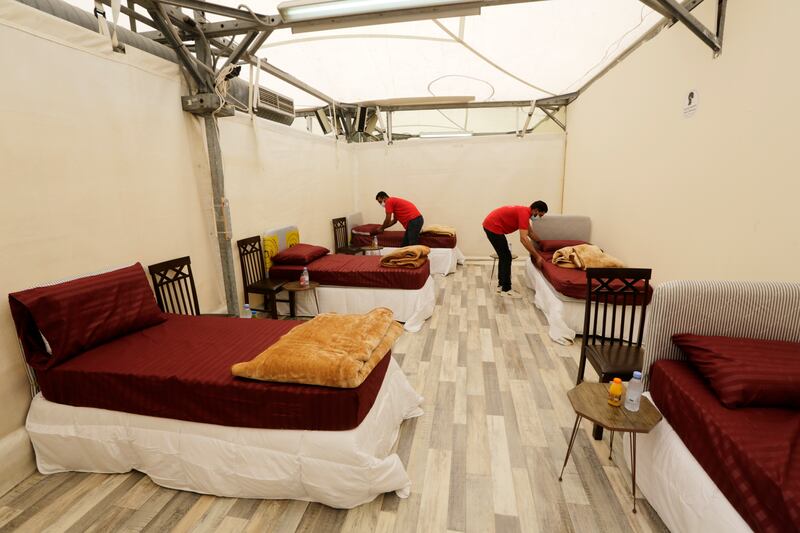 .Workers set up accommodation for pilgrims in Mina.