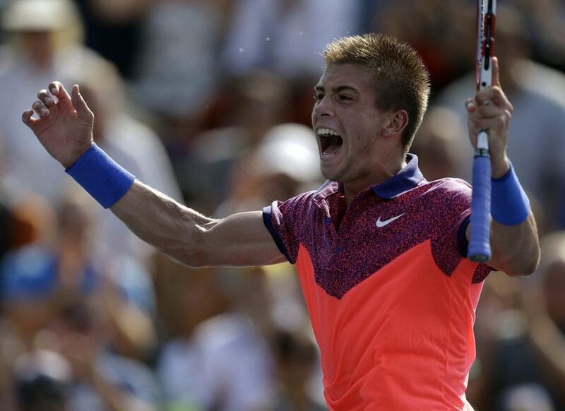 Borna Coric, of Croatia, reacts after defeating Lukas Rosol, during the first round of the 2014 US Open on Tuesday. Darron Cummings / AP / August 26, 2014 
