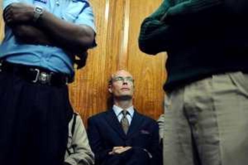 Thomas Cholmondeley, son of the fifth Baron Delamere and great-grandson of Kenya's most prominent early settler, sits on May 12, 2009 in Nairobi High court. A Kenyan court will on May 12 deliver its sentence against Cholmondeley, 40, a white aristocrat convicted of manslaughter over the killing of Robert Njoya, who he suspected of being a poacher on his Rift Valley ranch in 2006. The judge last week reduced the charge from murder to manslaugher, but the Eton-educated aristocrat has only admitted to shooting dogs on his 55,000-acre ranch.  AFP PHOTO / SIMON MAINA