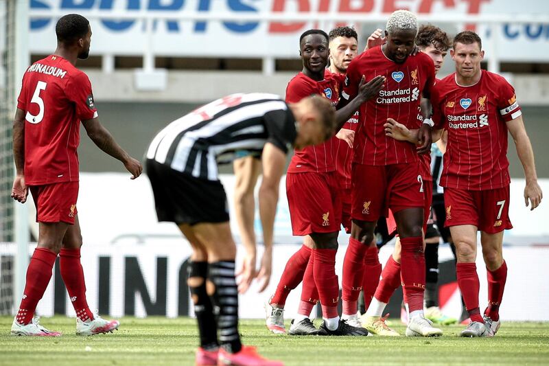 Divock Origi - 7: Had done very little up against a makeshift Newcastle defence before curling home a lovely goal just before the hour mark. EPA