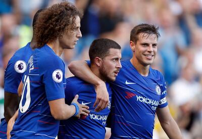 Chelsea's Eden Hazard celebrates with teammates after scoring his side's second goal during the English Premier League soccer match between Chelsea and Bournemouth at Stamford Bridge stadium in London, Saturday, Sept. 1, 2018.(AP Photo/Frank Augstein)