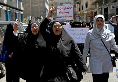 Residents and family members in Roumieh prison gesture during a protest calling for the release of militants detained by Lebanese forces on May 15. Reuters