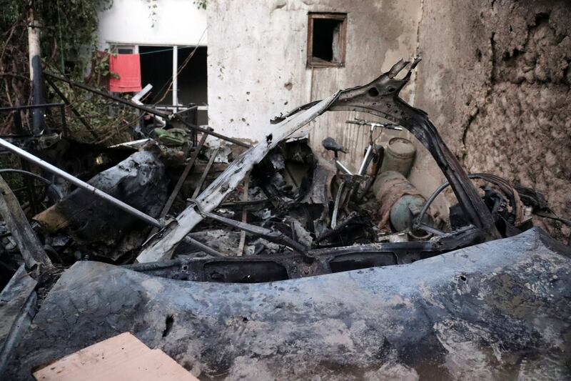 A destroyed vehicle is seen inside a house after a US drone strike in Kabul. AP Photo