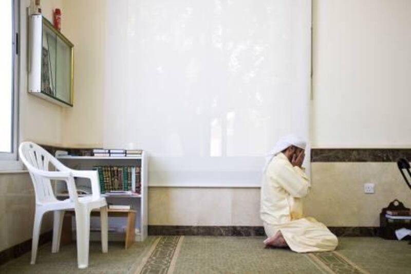 August 04. Imam Taha Abdul Razak prays at midday at the Shams Abdul Raheem Mosque in Al Safa. August 04, Dubai. United Arab Emirates (Photo: Antonie Robertson/The National)