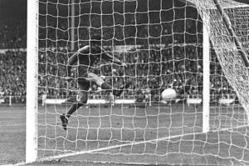 George Best scores a goal, ruled out for offside, against Benfica.