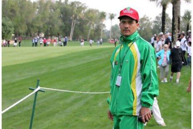 Hashmatulla Sarwary, a golfer from Afghanistan, watches Tiger Woods play at the Emirates Golf Club in Dubai.