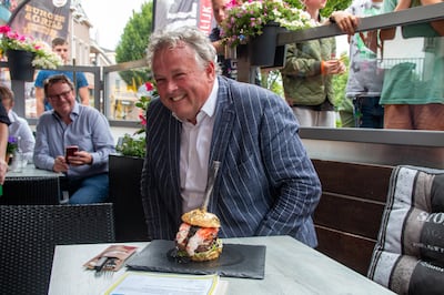 Rober Willemse, chairman of the Royal Dutch Food and Beverage Association, ate the $5,964 burger. Courtesy De Daltons