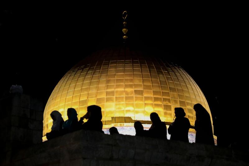 Palestinian worshippers seek Laylat Al Qadr as they pray in front of the Dome of the Rock at the Al Aqsa Mosque compound in Jerusalem's Old City. AP Photo