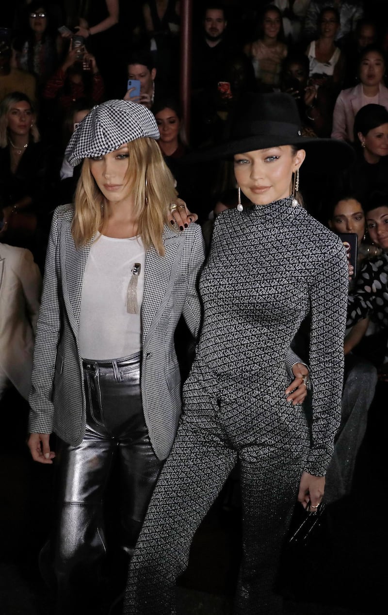 epa07829240 US fashion models Bella (L) and Gigi Hadid (R) pose for photographers before the Tommy Hilfiger fashion show during New York Fashion Week in New York, New York, USA, 08 September 2019. New York Fashion Week shows for designer's Spring and Summer lines are being held from 05 to 11 September 2019.  EPA-EFE/PETER FOLEY