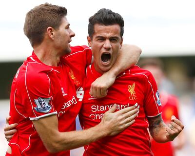 Steven Gerrard and Philippe Coutinho as Liverpool teammates in 2014. Reuters