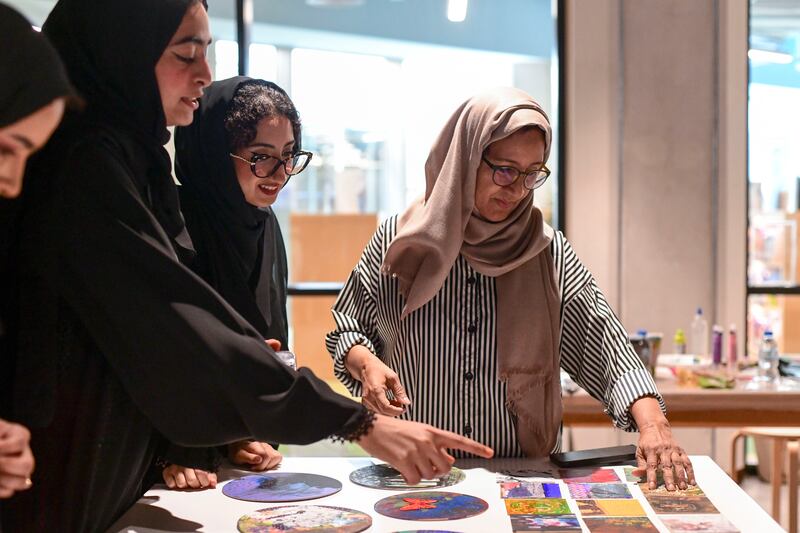 Najat Makki, Emirati visual artist interacts with the young artists at the workshop in the Cultural Foundation, Abu Dhabi. Khushnum Bhandari / The National