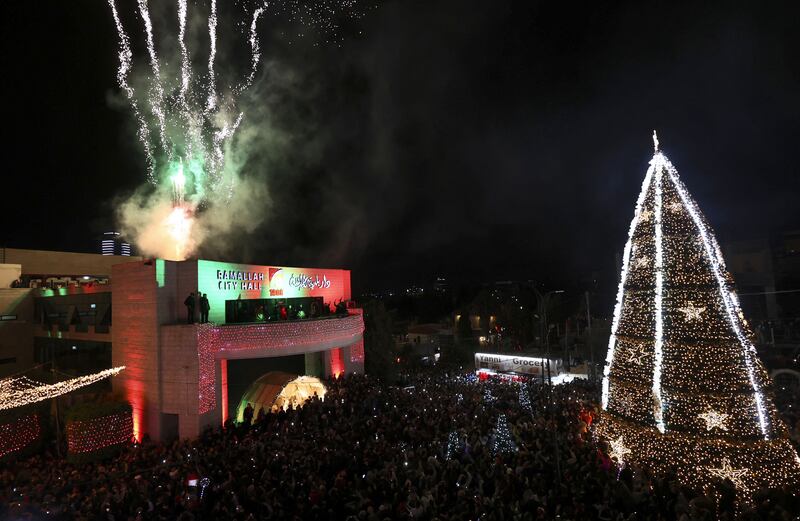 Crowds gather for celebrations marking the lighting of the Christmas tree in Ramallah. AFP