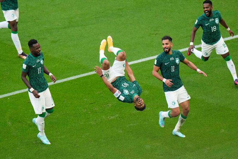 Saudi Arabia's Salem Al Dawsari celebrates in acrobatic fashion after scoring the winning goal in the Group C match against Argentina, at the Lusail Stadium in Lusail. AP