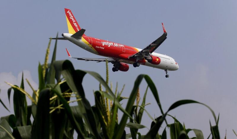 A VietJet airliner prepares for landing at Noi Bai airport, in Hanoi, Vietnam. The carrier saw its stock surge on its market debut on Tuesday. Kham / Reuters