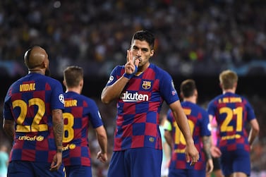 Luis Suarez celebrates the second of his two goals in Barcelona's 2-1 win over Inter Milan. Getty Images