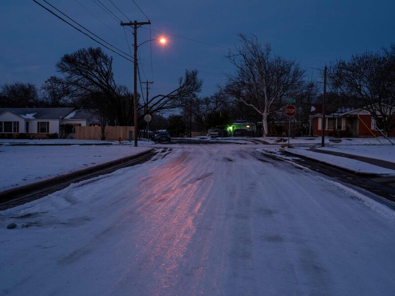 Ice and snow covers a street in Waco, Texas, after a winter storm that caused power cuts across the state. AFP