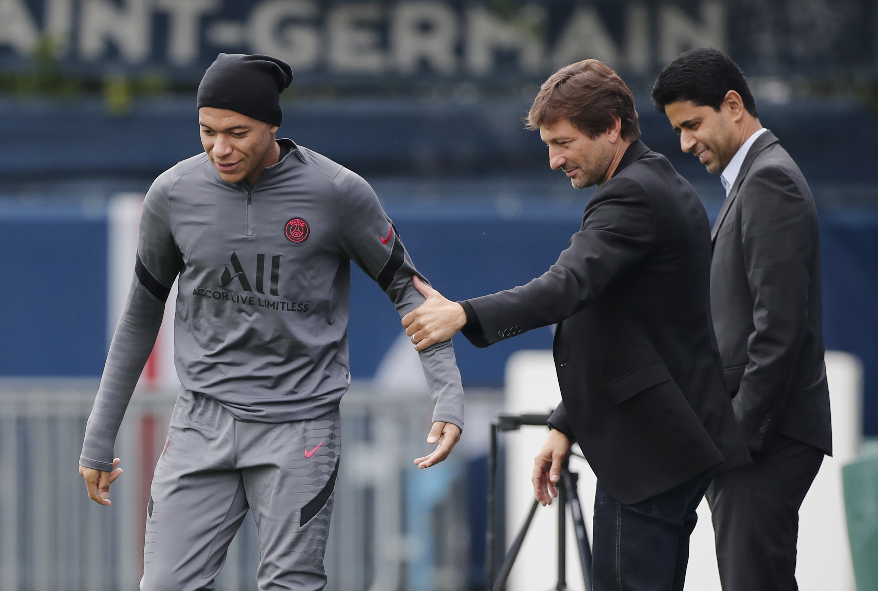 Paris Saint-Germain's Kylian Mbappe with sporting director Leonard. Reuters