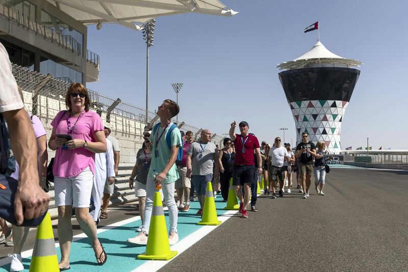 Abu Dhabi, United Arab Emirates, November 23, 2017:    Fans take part in the pit lane walk during previews for the Abu Dhabi Formula One Grand Prix at Yas Marina Circuit in Abu Dhabi on November 23, 2017. Christopher Pike / The National

Reporter: John McAuley, Graham Caygill
Section: Sport