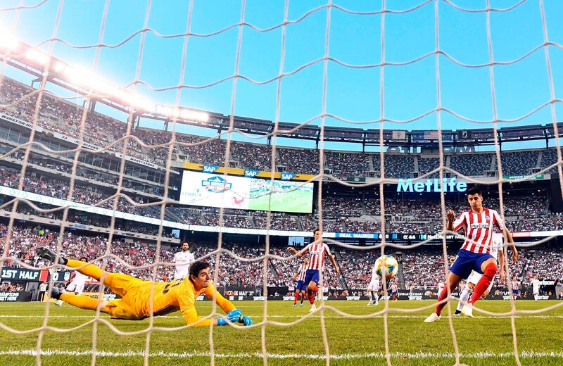 Atletico Madrid's Diego Costa scores his first of four goals against Real Madrid. AFP