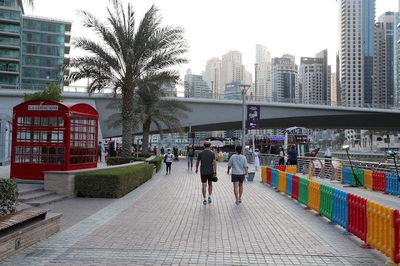 DUBAI, UNITED ARAB EMIRATES , October 12 – 2020 :- View of the marina walk in Dubai Marina in Dubai. (Pawan Singh / The National) For Stock