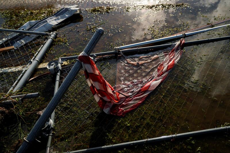 An American flag sits in floodwater in Florida. Reuters
