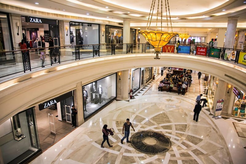 Shoppers walk past a Zara store inside the DLF Promenade shopping mall in New Delhi. Graham Crouch / Bloomberg News